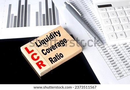 Word LCR- LIQUIDITY COVERAGE RATIO made with wood building blocks, business