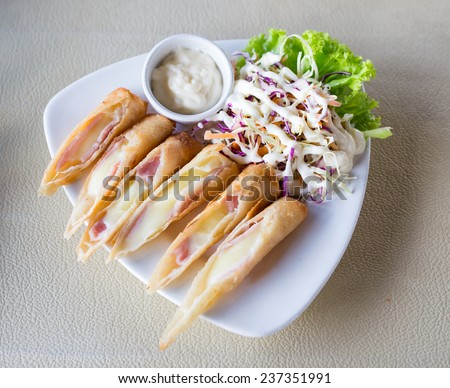 Fried  dumplings with ham and cheese wrapped inside