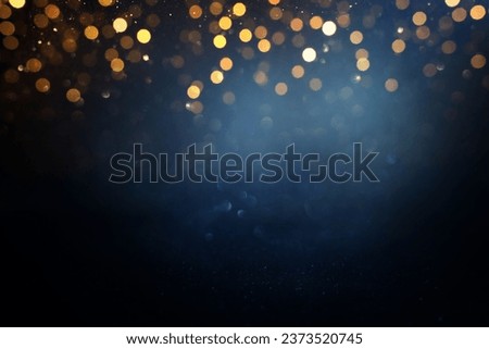 abstract glitter black, gold , blue lights background. de-focused