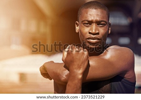 Fitness, portrait and man stretching arms outdoor for running, workout and training on blurred background. Face, stretch and African male runner with serious, focus and mindset, training and warm up Royalty-Free Stock Photo #2373521229