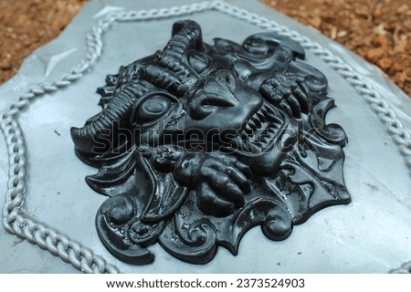 close up of a child's shield toy with a black dragon on it