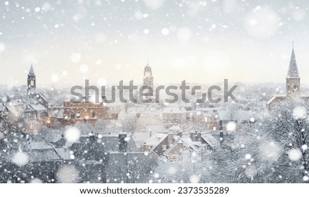 Magical winter snow fall and city lights. blurred background city street with Christmas illuminations, blurred holiday background. Christmas lights and Christmas decorations on the street. For banner