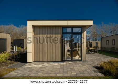 Outdoor recreation. small modern comfortable houses in a suburban recreation area. Camping, family vacation Royalty-Free Stock Photo #2373542377