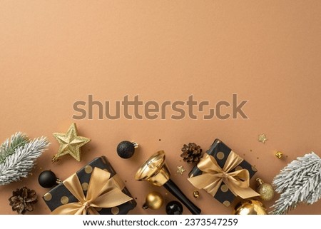 Be inspired by festive Christmas arrangement. Top view of elegant gift boxes, luxury black and gold balls, dazzling star, confetti, bell, frosted fir on terracotta backdrop, space for your message Royalty-Free Stock Photo #2373547259