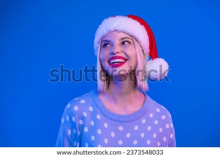 Photo of positive cute lady beaming smile look empty space festive ad offer isolated on neon blue color background