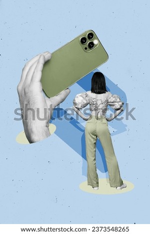 Vertical creative collage of hand hold smartphone make photo of popular woman stand turned with her back isolated on blue color background