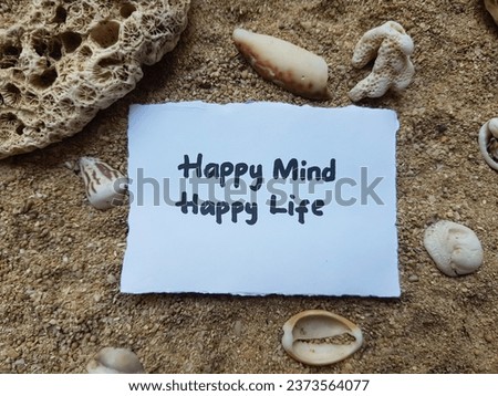 Motivational writing on beach sand background.