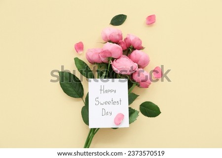 Greeting card with text HAPPY SWEETEST DAY and bouquet of rose flowers on yellow background. National Sweetest Day Royalty-Free Stock Photo #2373570519