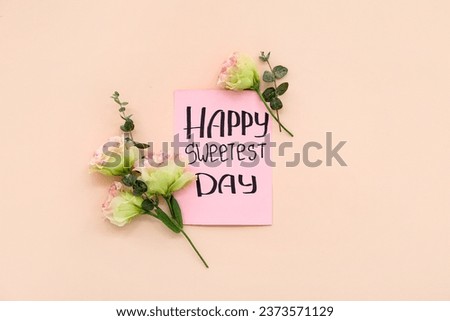 Greeting card with text HAPPY SWEETEST DAY and carnation flowers on pink background. National Sweetest Day Royalty-Free Stock Photo #2373571129
