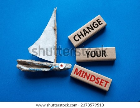 Change your mindset symbol. Concept words Change your mindset on wooden blocks. Beautiful blue background with boat. Business and Change your mindset concept. Copy space.