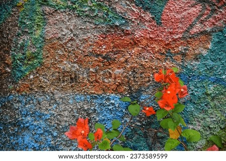 beautiful background of green leaves and small flowers of various colors