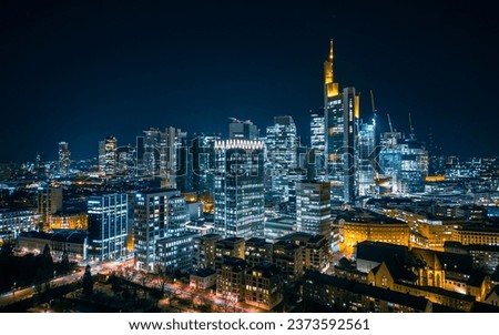 An aerial view of the illuminated skyline of Frankfurt am Main, Germany at night Royalty-Free Stock Photo #2373592561