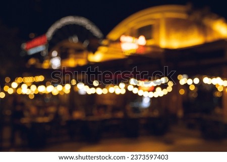 blurred defocused bokeh lights from night market in Thailand, abstract colourful background.