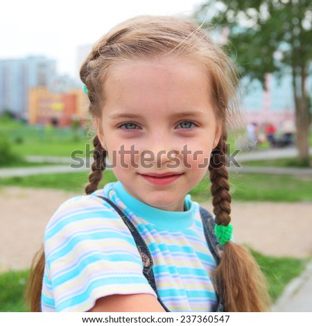 closeup image of the pretty little girl outdoors