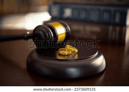 Divorce law, family law concepts. Court gavel ,ring and law book at lawyer office. Royalty-Free Stock Photo #2373609131