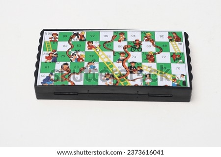 Children's games, snakes and ladders, board games. Team building games concept.