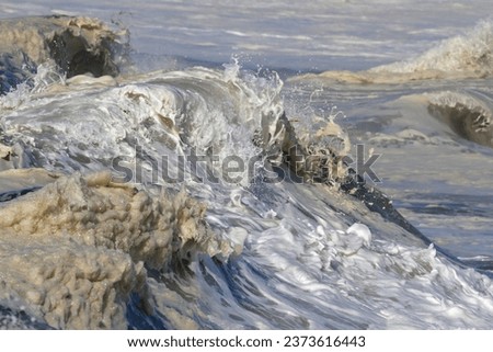 Top of a detailed big breaking sea wave