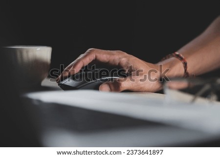 Picture of male hand on computer mouse