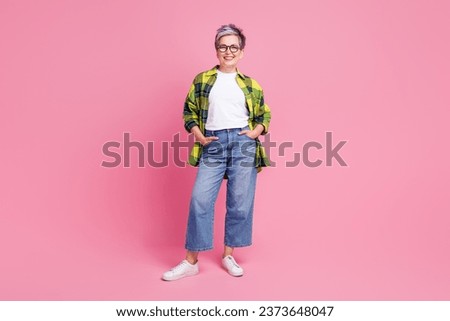 Full size photo of optimistic person with white gray hairdo dressed plaid shirt hold hands in pockets isolated on pink color background