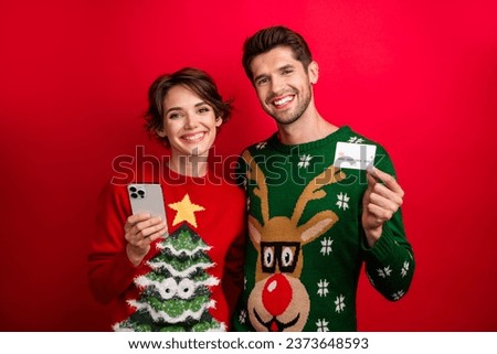 Photo of two people friends lady guy using cell smart device buying paying order present with debit card isolated shine color background