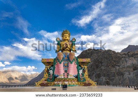 Diskit Monastery or  Diskit Gompa is the largest and oldest Buddhist monastery in Nubra Valley, Ladakh, India. 108 feet tall statue of Maitreya Buddha. Buddha Statue with beautiful sky in background. 