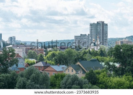 Cityscape of a green residential area with buildings in the city of Cheboksary, Russia Royalty-Free Stock Photo #2373683935