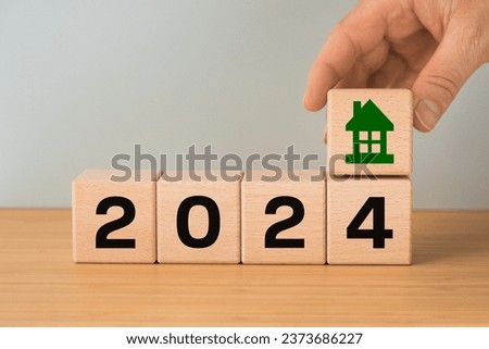 2024, housing market analysis, construction cost, apartment prices, apartment rent, mortgage rate, Business and financial concept, typography, Wooden blocks with date and house icon, copy space