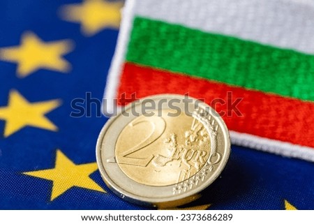 adoption of the Euro by Bulgaria, joining the euro zone, economic concept, euro coins, Bulgarian money, flag of Bulgaria and the European Union Royalty-Free Stock Photo #2373686289