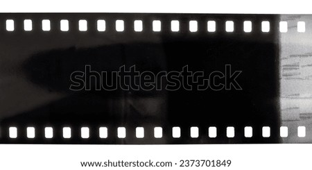 underexposed 35mm film on white background with scanning light mistakes. Royalty-Free Stock Photo #2373701849