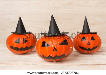 Halloween composition with jack o lanter decor on wooden background
