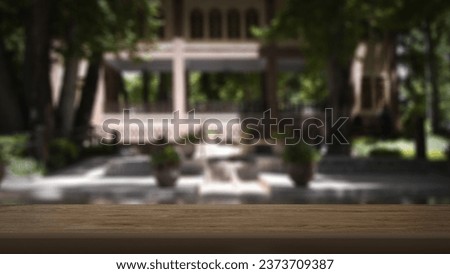Blank wooden table with naturally blurred background. Good for product arrangement