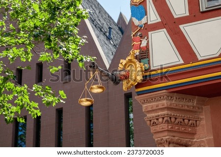 Detail of the golden scale in Frankfurt, Germany