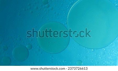 nice background, abstract background of oil bubbles on water with blue light