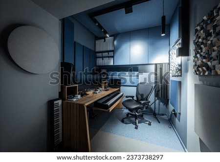 Interior of a small recording studio with equipment