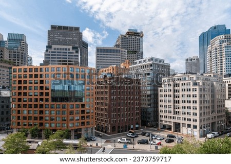 Panoramic financial downtown city view of Boston from Harbour area at day time, Massachusetts. An intellectual, technological and political center. Building exteriors.