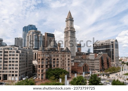 Panoramic city view of Boston from Harbour area at day time, Massachusetts. An intellectual, technological and political center. Building exteriors.