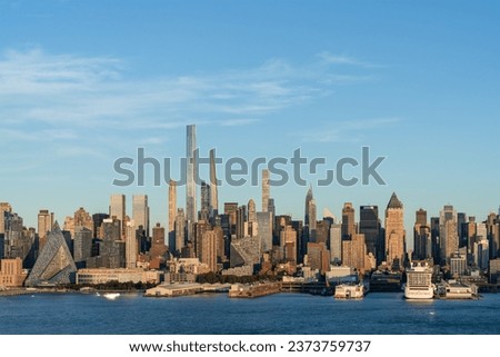 New York City skyline from New Jersey over the Hudson River with the skyscrapers at day time. Manhattan, Midtown, NYC, USA. A vibrant business neighborhood Royalty-Free Stock Photo #2373759737