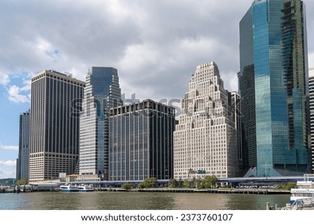 Skyline of New York City Financial Downtown Skyscrapers over East River at day time, Manhattan, NYC, USA. A vibrant business neighborhood