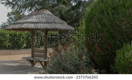 Outdoor Wooden bench with grass sunshade