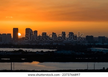 Urban sunset landscape of downtown district of Tampa city in Florida, USA. Dramatic skyline with high skyscraper buildings in modern American megapolis