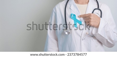 Blue November Prostate Cancer Awareness month, Doctor with Blue Ribbon in hospital for support people life and illness. Healthcare, International men, Father, Diabetes and World cancer day Royalty-Free Stock Photo #2373784577