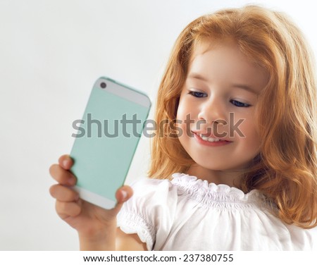 a beauty child taking selfie