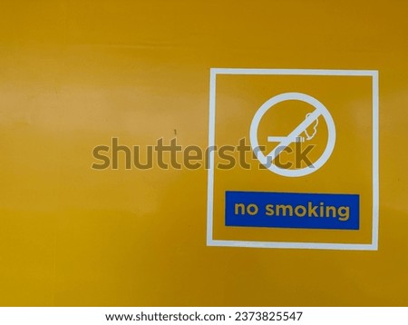 No smoking sign on a yellow wall. Illustration of a smoke-free room for lung health.