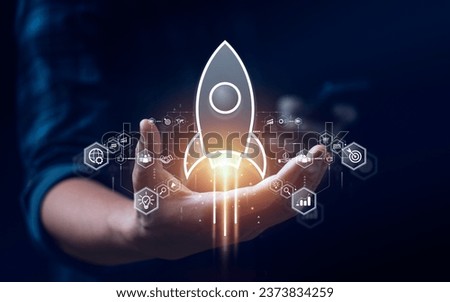 Startup business concept, rocket is launching and flying from hand to sky for growing business, fast business success. startup founder, network connection, idea generation, digital marketing Royalty-Free Stock Photo #2373834259