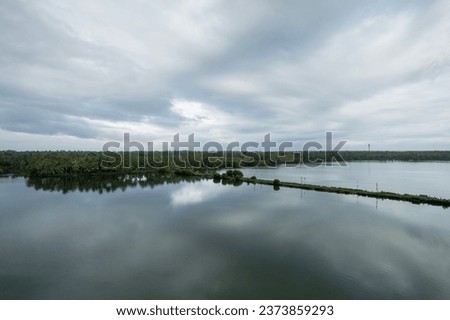 Beautiful natural scenery of river in Kannur Kavvayi island, Aerial drone shot of river with palm trees Royalty-Free Stock Photo #2373859293
