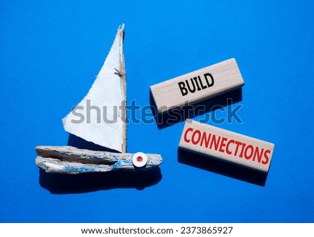 Build Connections symbol. Concept word Build Connections on wooden blocks. Beautiful blue background with boat. Business and Build Connections concept. Copy space
