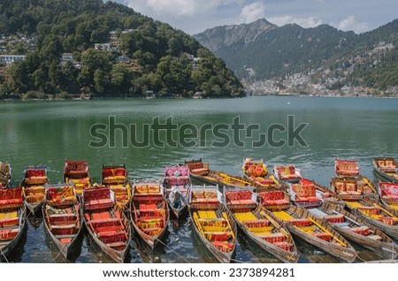 Colorful boats for tourists in the Naini lake, Nainital, Uttarakhand, India. Royalty-Free Stock Photo #2373894281