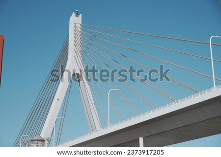 Contrast between blue sky and bridge Royalty-Free Stock Photo #2373917205