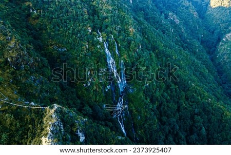 Drone view of Tindhare waterfall in middle of forest, Kavre, Nepal. 