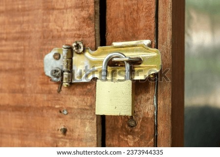 padlock installed on wooden door